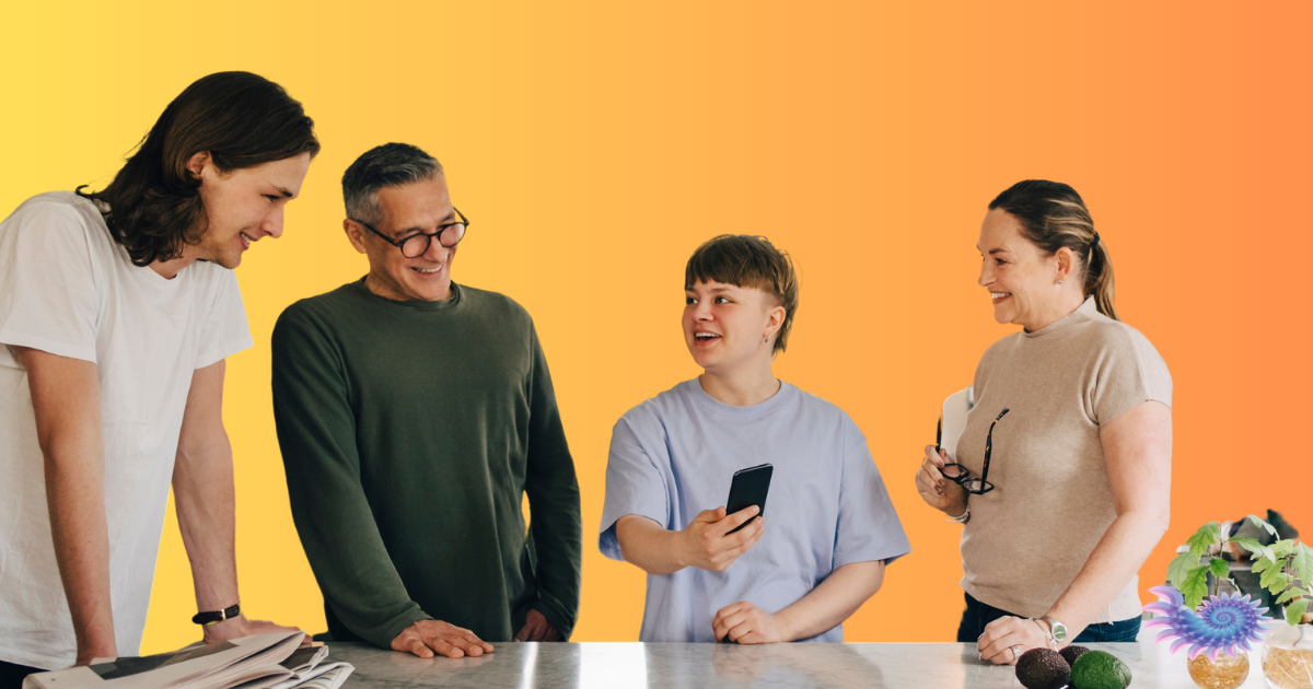 Family gathered around a kitchen island with their trans family member laughing as one at the anti-trans material they're seeing on social media because they feel so confident and supported on their collective gender journey