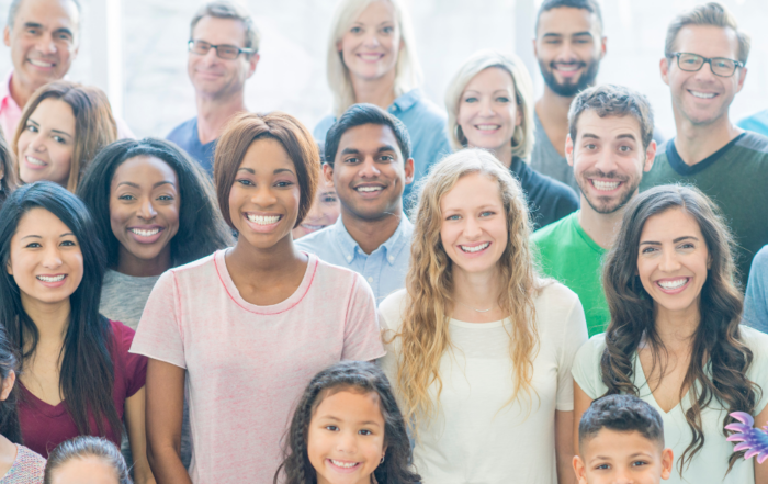 Group of diverse parents and family members gathered together in a group, haloed in a healing white light