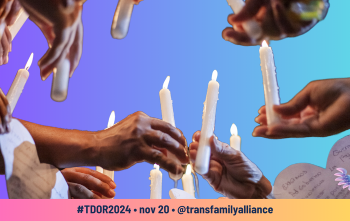 Hands lighting candles memorializing victims of hate and violence and in commemoration of Transgender Day of Remembrance (#TDOR)