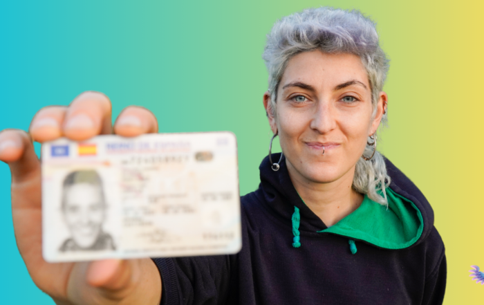 Nonbinary individual holding up a non-gender specific identification card