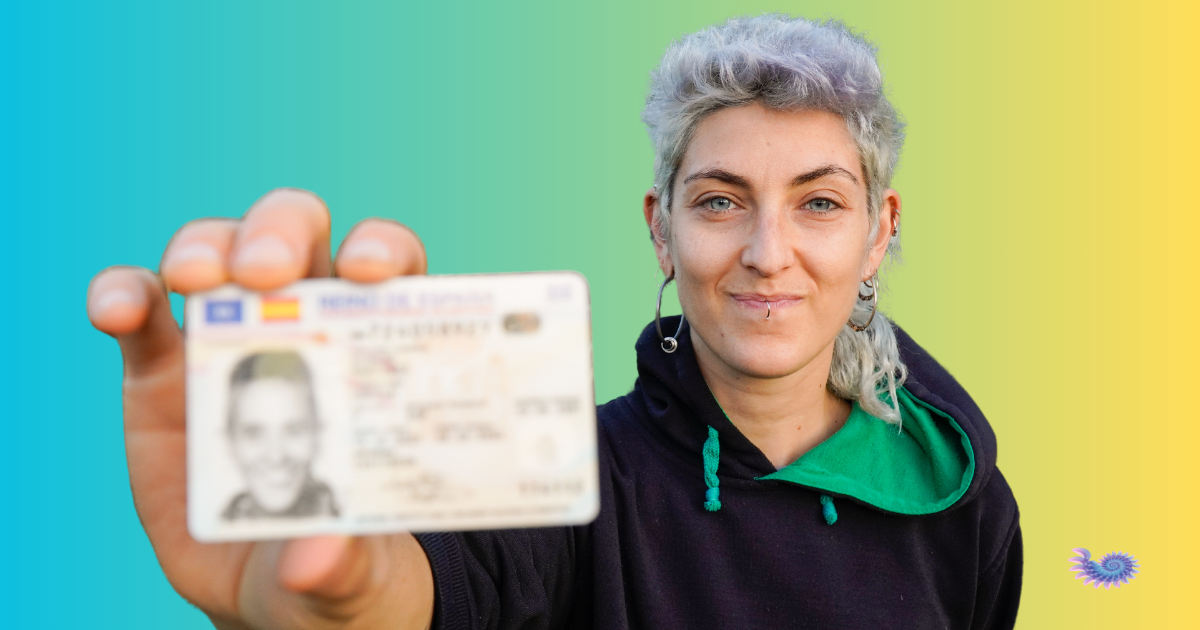 Nonbinary individual holding up a non-gender specific identification card